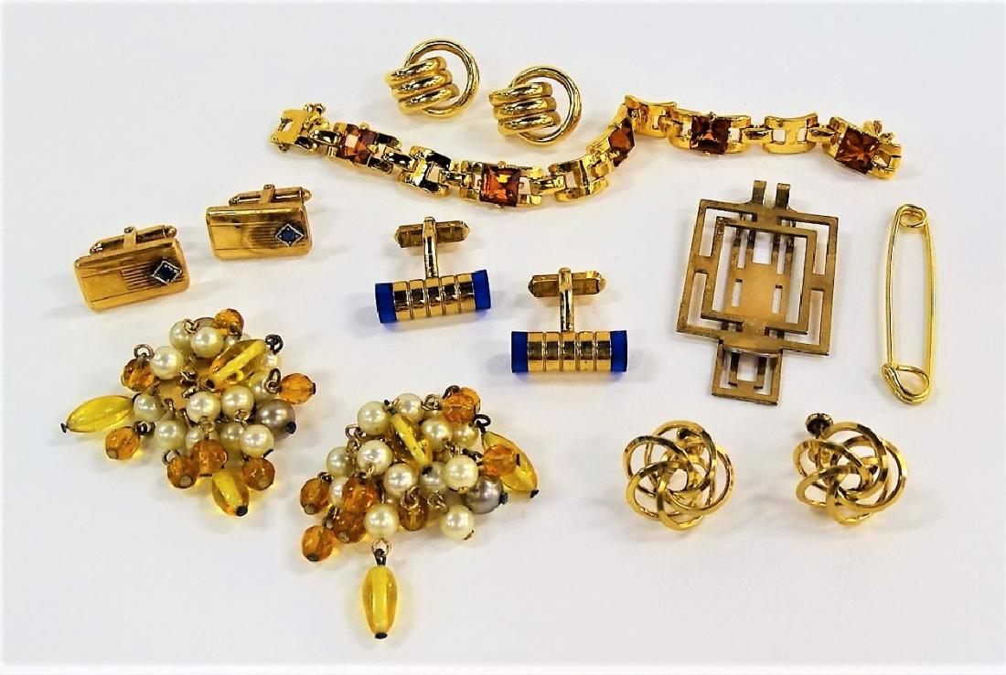 LARGE LOT OF COSTUME JEWELRY: To include a pair of Krisler Quality 12K GF cuff links, a pair of gold tone earrings, a gold tone pin, an unsigned Mazer Bros gold tone w/ faux topaz bracelet, a pair of gold tone w/ faux citrine and