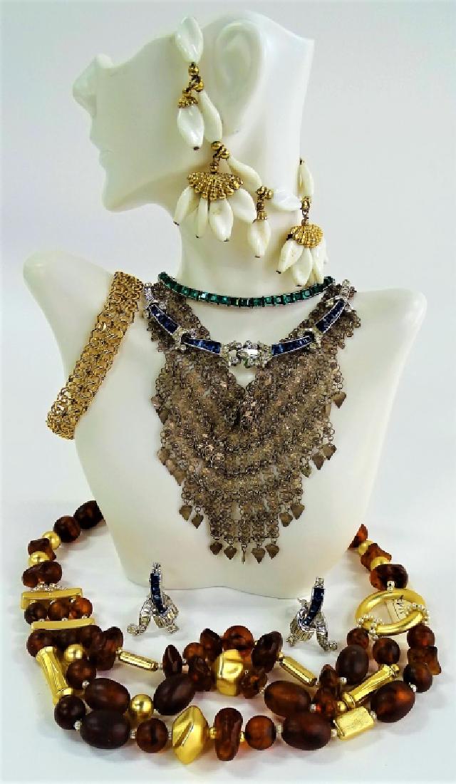 LARGE LOT OF COSTUME JEWELRY: To include a silver tone w/ faux emerald line choker necklace, a Fedra brown stone and gold tone necklace, a Napier gold tone w/ white bead bracelet, a Mazer silver tone w/ blue and clear rhinestone s