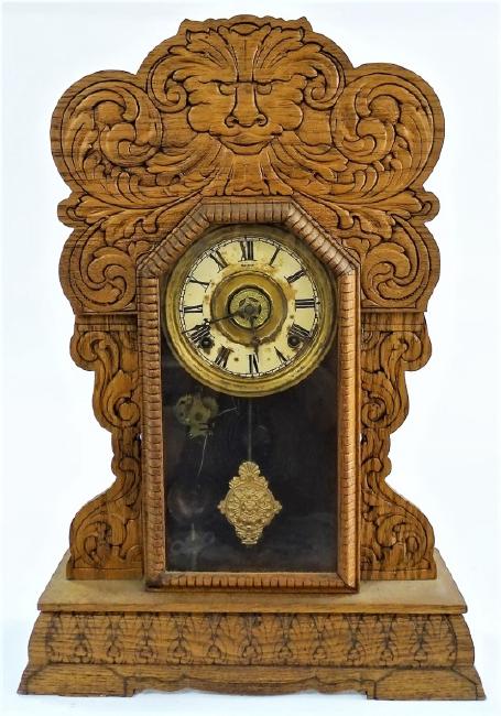 Early 20th century American pressed Oak case gingerbread clock