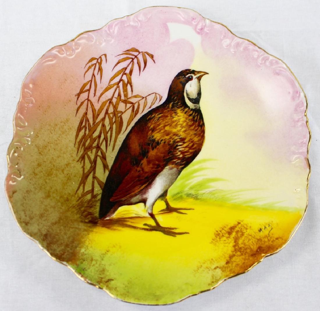 ANTIQUE CORONET LIMOGES H/P PORCELAIN BIRD PLATE: Early 20th century Coronet Limoges France hand-painted Porcelain plate. Decorated with transfer printed depiction of a game bird, on a hand-painted gorund. Having gilt scalloped edges. Artist signed i