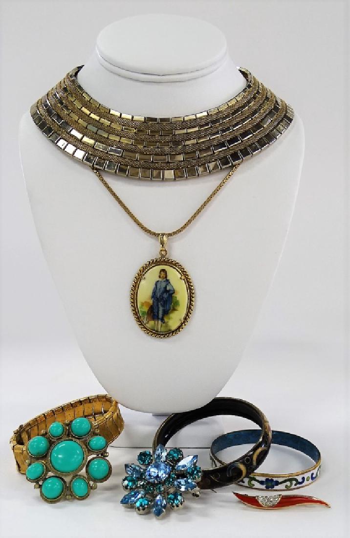 LARGE LOT OF COSTUME JEWELRY: To include a Kramer of NY Cleopatra style gold tone choker necklace, an Austrian made silver tone w/ blue glass floral pin, an Eisenberg red enamel w/ rhinestone pin, a German made gold filled bracele
