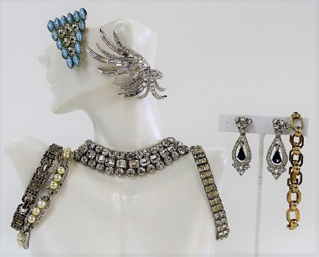 LARGE LOT OF COSTUME JEWELRY: To include; a Nolan Miller Rhinestone brooch, a Weiss Rhinestone bracelet, a goldfilled link bracelet, a pair of ornate drop earrings with simulated Sapphires, a Jomaz imitation Pearl & Rhinestone bra