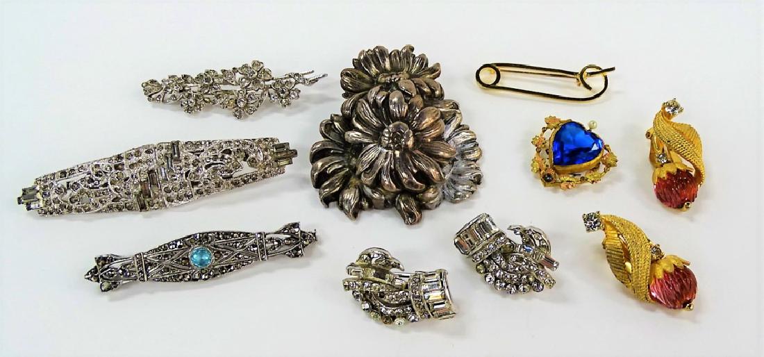 LARGE LOT OF COSTUME JEWELRY: To include; a repousse floral pin, a pair of Pennino gold tone jeweled earrings, a Victorian gold tone heart pin, a vintage silver tone Rhinestone duette, a gold filled "safety pin" pin, a Deco French