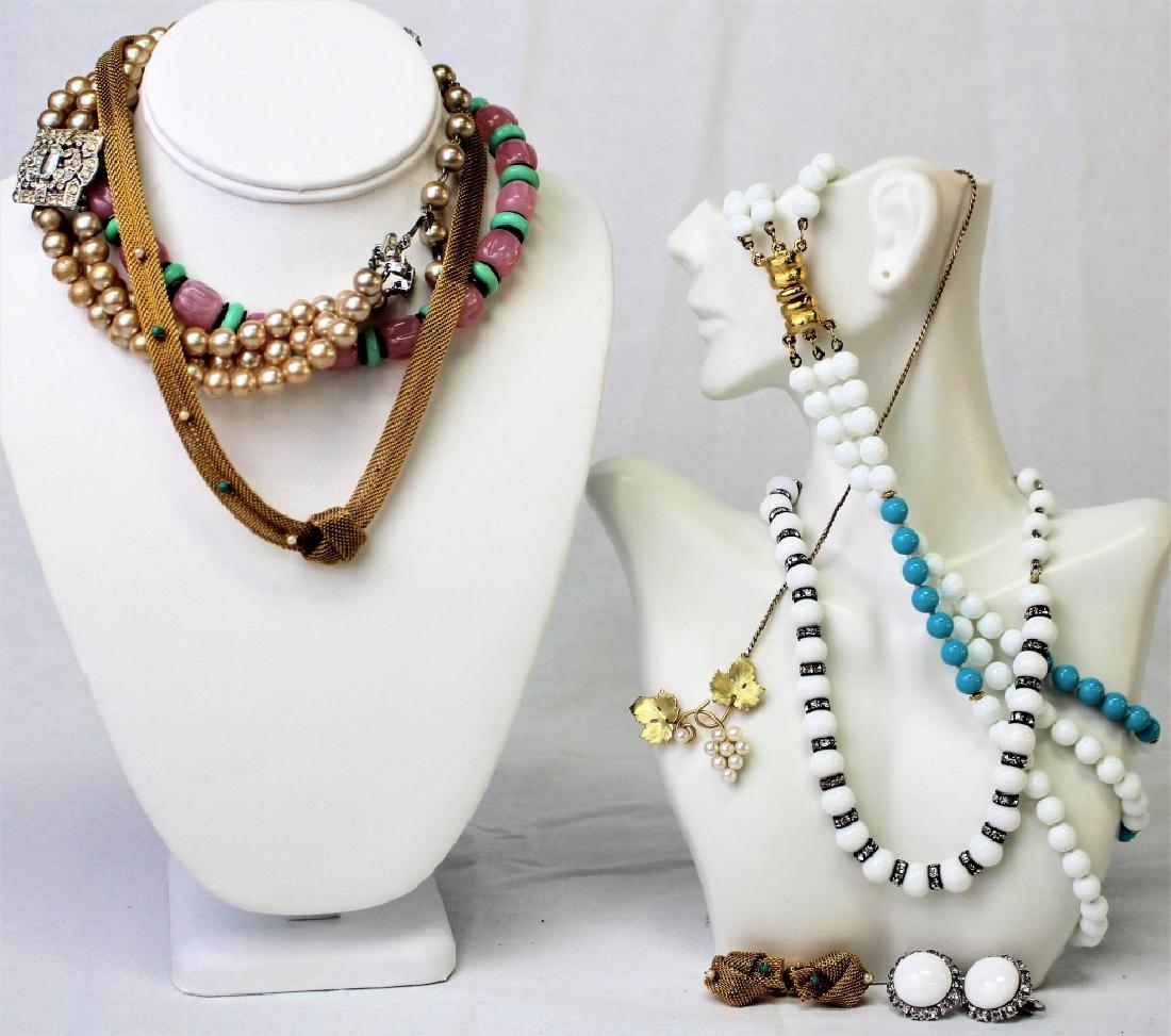 LARGE LOT OF COSTUME NECKLACES: To include a Krementz leaf and faux pearl grape necklace, a Vogue set of white bead and rhinestone necklace and earrings, a French Deco rose quartz necklace, a Mazer blue & white triple strand necklac
