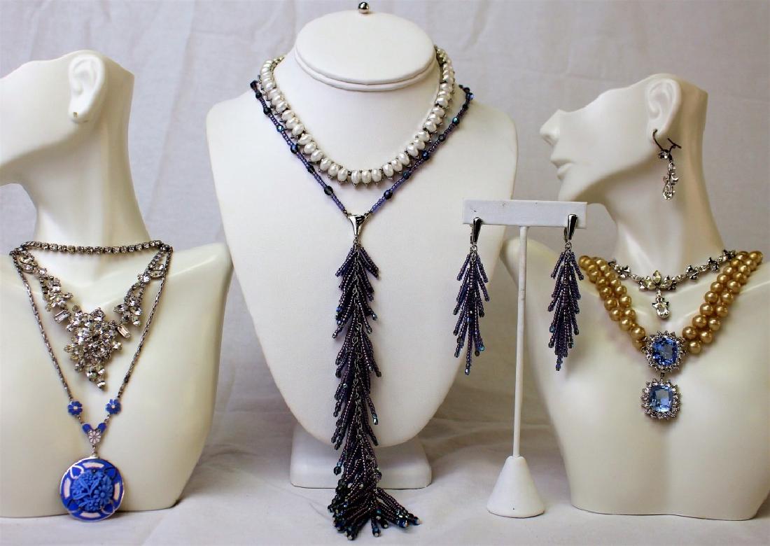 LARGE LOT OF COSTUME NECKLACES: To include a Weiss rhinestone floral choker necklace, a Trifari sterling w/ faux pearl choker necklace, a Trifari long purple bead dangle necklace w/ earrings (original tag), a Mazer Blue faux pearl d