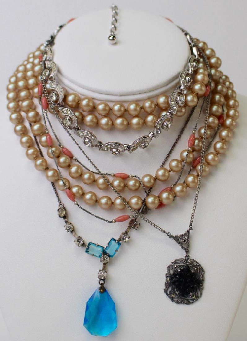 LOT OF EXTRAORDINARY COSTUME NECKLACES: To include a Deco delicate apricot & chain necklace, an Ora rhinestone necklace, a Deco marcasite and glass necklace, a Deco blue glass necklace, and a double strand faux pearl necklace. Shipping to b