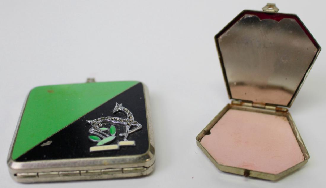 VINTAGE LOT OF COSTUME COMPACTS: To include a green and black enameled compact w/ marcasite giraff and a beige enameled compact. Shipping to be $15 US. We will combine w/ price.