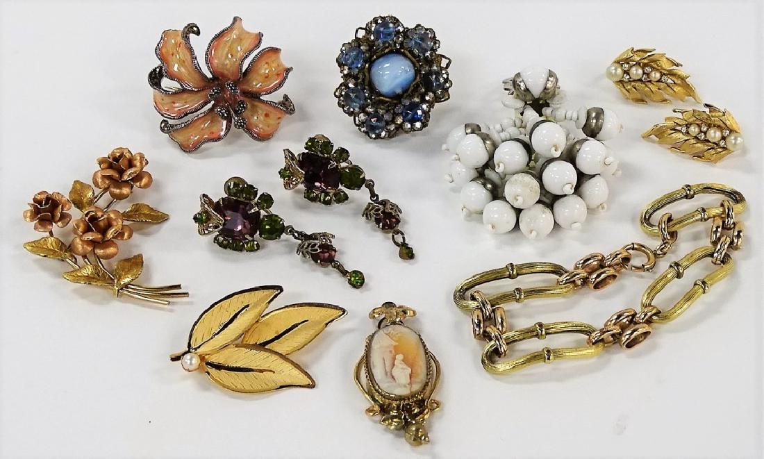 LARGE LOT OF VINTAGE COSTUME JEWELRY: To include, unsigned Haskell clip,multi colored earrings,gold tone and faux pearl earrings,gold filled floral pin, gold filled link bracelet, victorian cameo,gf floral brooch,sterling Judith Jack enam