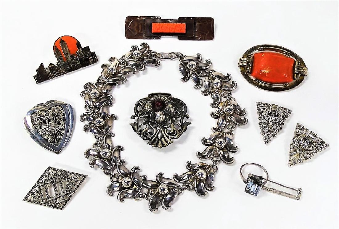 LOT OF VINTAGE COSTUME JEWELRY INC ART NOUVEAU: To include a GFMN sterling w/ carnelian NYC pin, a Fabon of Paris .725 silver w/ red stone pin, a pair of Clip-Mates white rhinestone fur clips, a Deco pin, a French nickel floral heart fur clip, a De