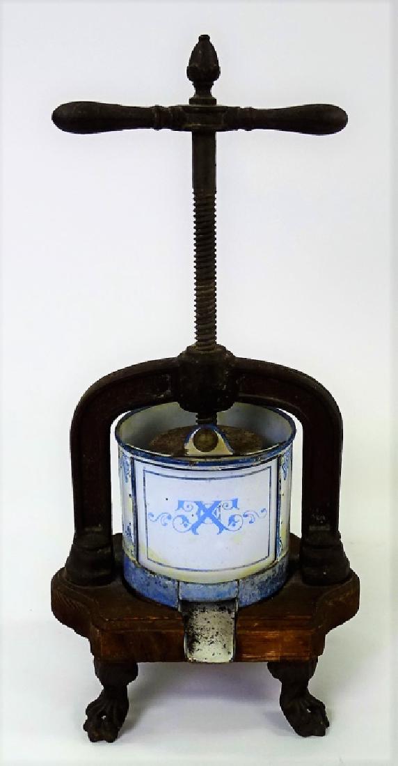 ANTIQUE WOODEN AND BRASS JUICER: Antique wooden and brass juicer with metal bowl insert with 4 feet. Measures approx 18" tall. We will not ship this item. We can refer local shippers.