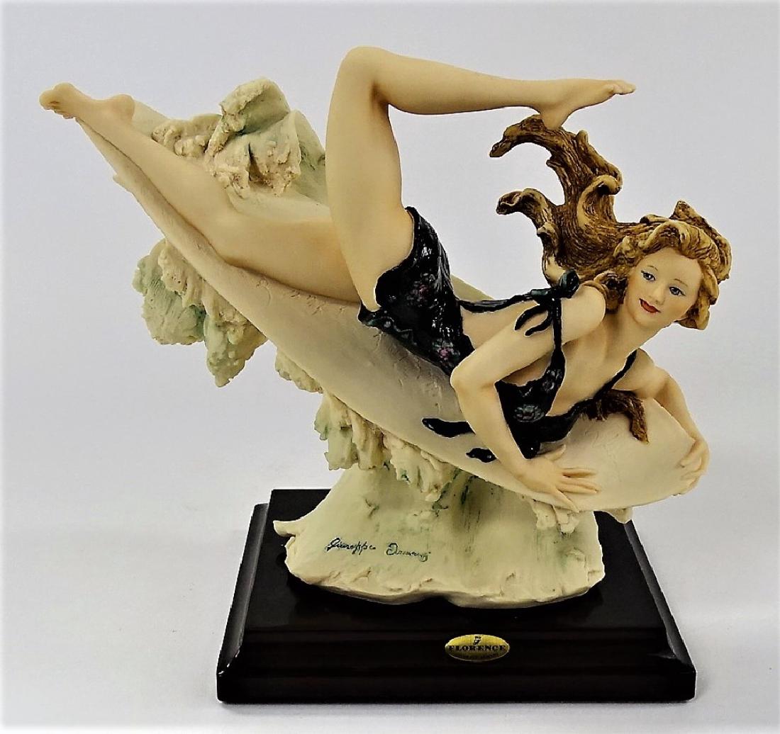 GUISEPPE ARMANI TITLED "SURFER" FIGURINE: Large Giuseppe Armani Florence collection titled "Surfer" #1310-C figurine. Measures approximately 7" tall. We will not ship this item. We can refer local shippers.