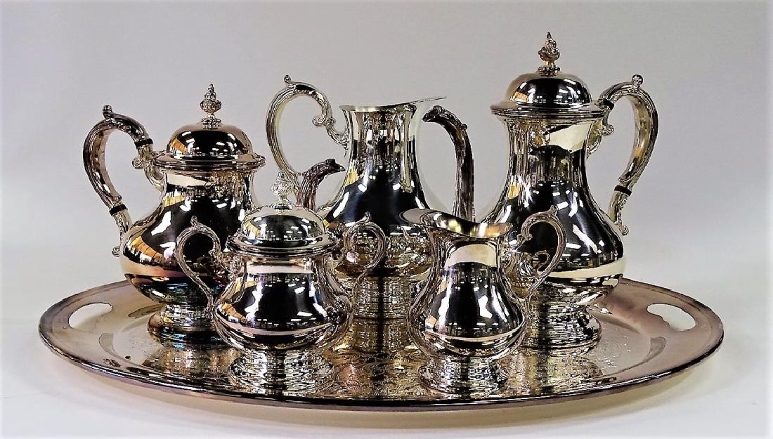 GORHAM SILVER PLATED TEA SET: This lot consists of a Gorham silver plated tea set. The items in the lot include a (1) pitcher, (2) creamer, (3) teapot, (4) coffee pot, (5) sugar pot, and (6) a serving tray. Each piece is marked Go