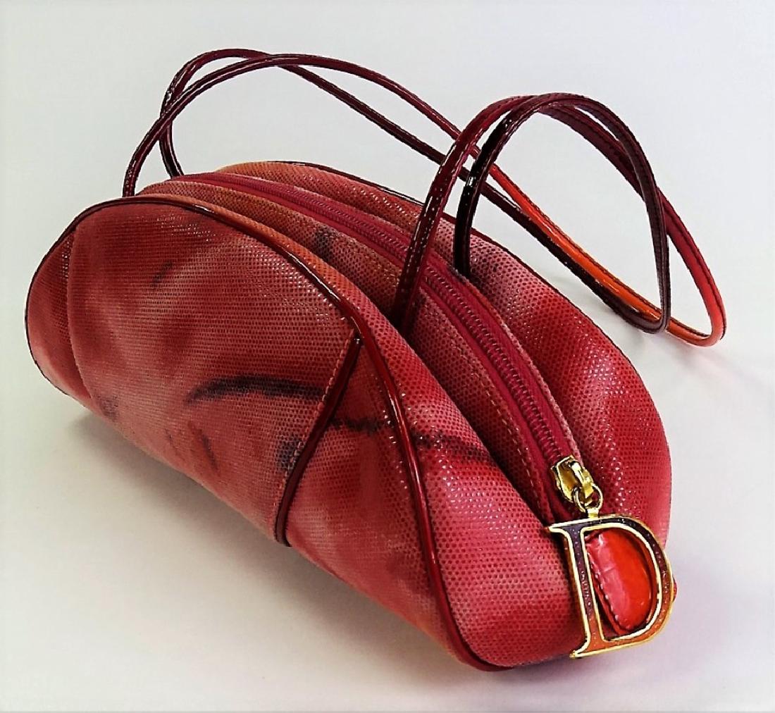 CHRISTIAN DIOR FUSCHIA SHOULDER BAG: Christian Dior Fuschia patent leather shoulder bag with gold tone "D" pendant/zipper & yellow nylon interior. Made in Italy. Date Code: MA-0031. Measures 13" Long x 4-1/2" Tall + 11-1/2" Shoulder Drop