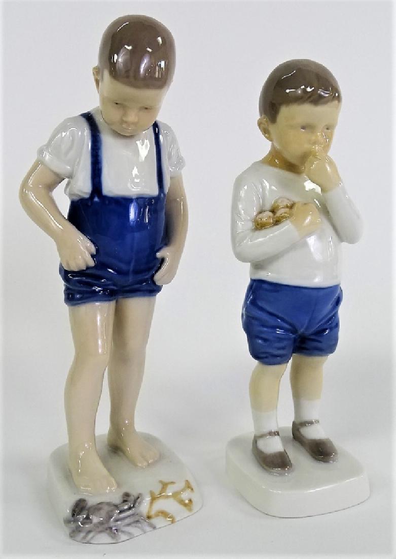 PAIR OF PORCELAIN BING AND GRONDAHL FIGURINES: Pair of Bing and Grondahl figurines of two boys. Measures approx 8" tall. Will not ship can refer local shippers.
