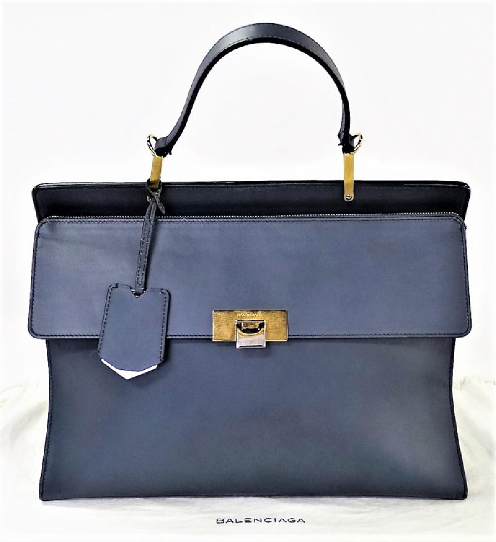 BALENCIAGA LE DIX CARTABLE CALFSKIN SATCHEL BAG: Balenciaga Le Dix Cartable Calfskin shoulder bag. In Gray Charcoal color Leather, with flat hand grip strap, stylized brushed gold tone hardware, and front flap with gold switch lock. Measures approx.