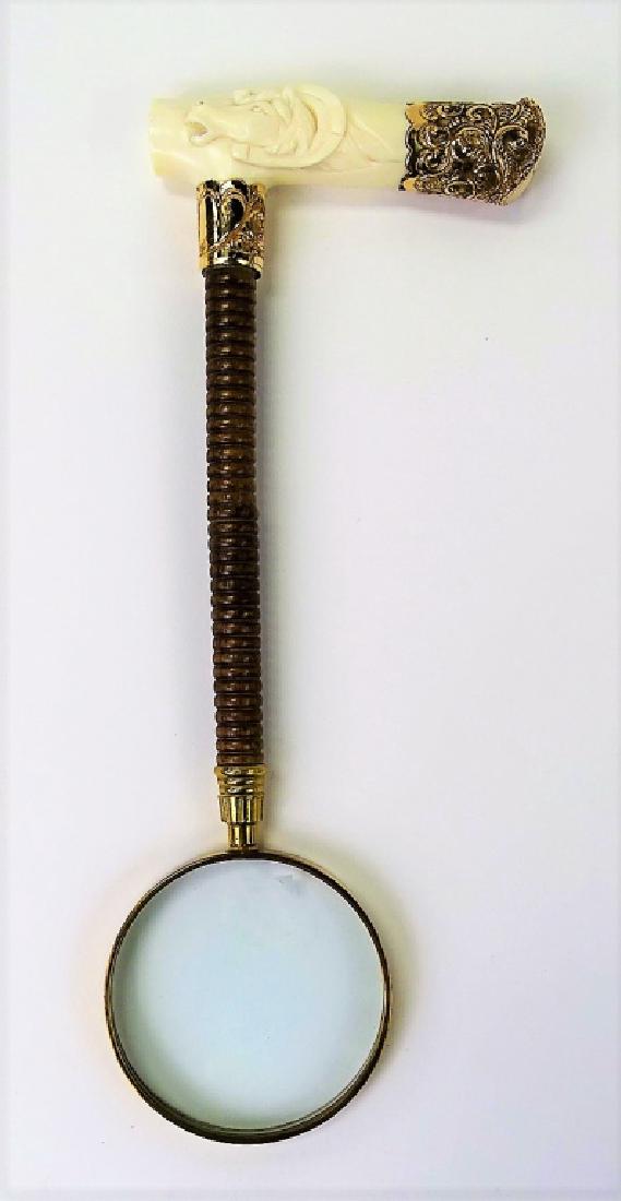 ANTIQUE CARVED HORSE HEAD MAGNIFYING GLASS: Measures 13 1/2" long. Gold tone foiled with sterling accents. Monogrammed, with fabulous carved horse head handle. Dated 1903. We will not ship, can refer local shippers.