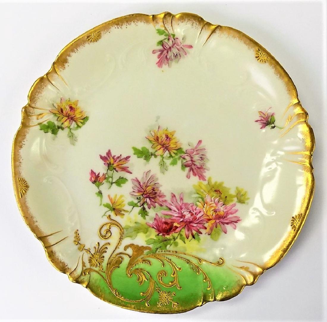 ANTIQUE LIMOGES HAND PAINTED FLORAL PLATE: Measures 9" in diameter. Antique red mark to base. In very good condition. Dates to the turn of the last century. We will not ship, can refer local shippers.