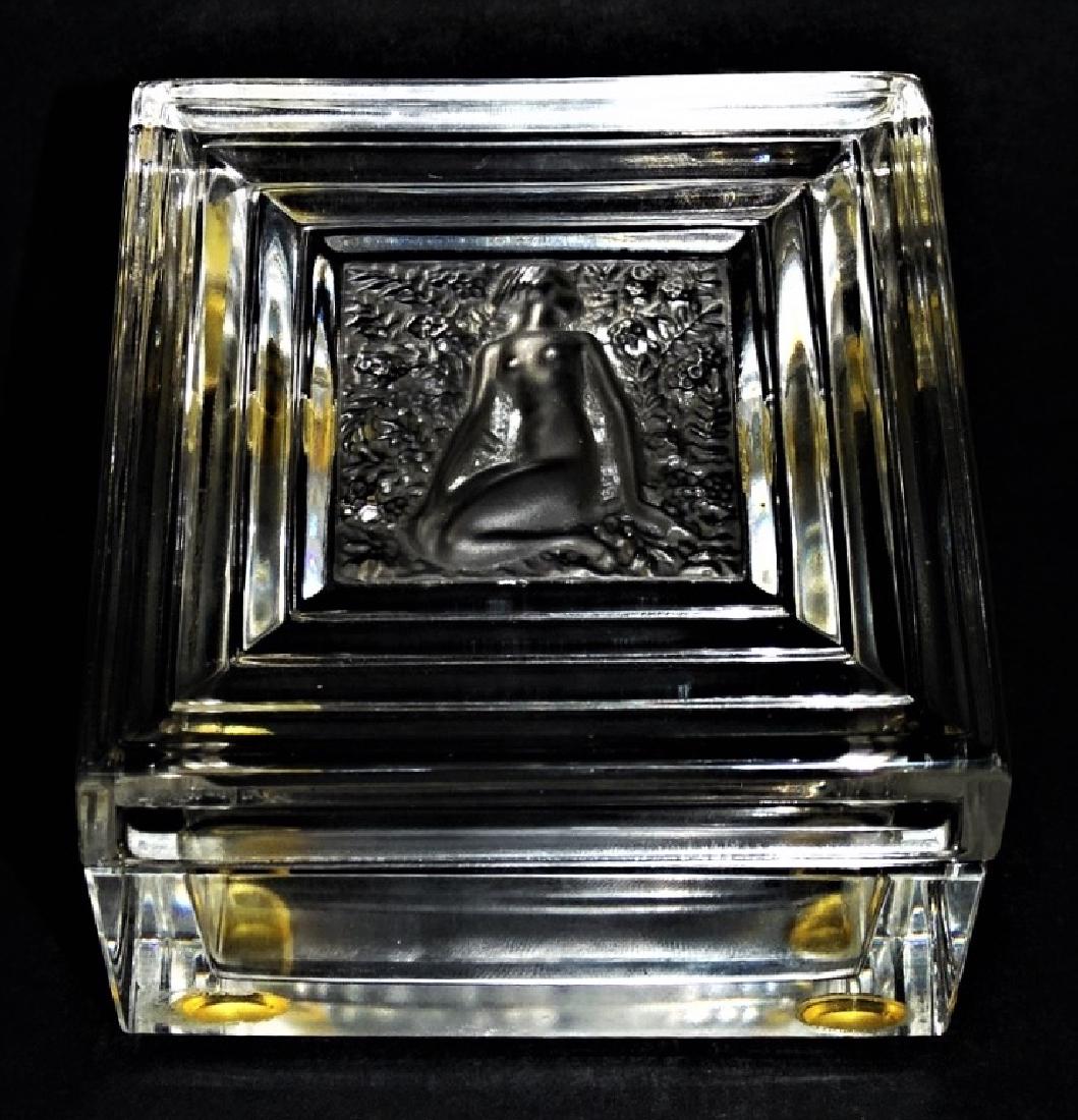 LALIQUE "DUNCAN" CLEAR CRYSTAL POWDER BOX: Lalique French molded & frosted Crystal "Duncan" powder box. In square shape with central medallion of nude, in clear color. Etched Lalique France signature to underside. Measures approx. 2-1/2" H x 3