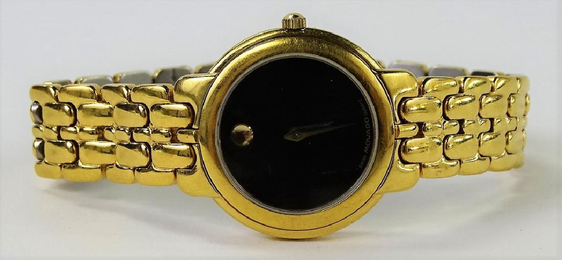 MOVADO SWISS MADE STAINLESS STEEL WATCH: Ladies' Movado Swiss made Stainless Steel watch. With gold tone design, quartz movement, and mystery dial. Will fit an extra large wrist, opening measures approx. 22-12/16" in diameter. Shipping to be