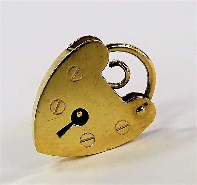 VICTORIAN 9KT YELLOW GOLD LOCK PENDANT: Victorian era 9 karat Yellow Gold lock pendant. Hallmarked and stamped ".375". Weighs approx. 1.2 dwt (1.8 grams). Shipping to be $20 + insurance in US.
