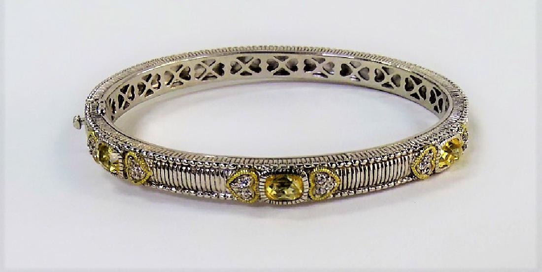 JUDITH RIPKA 18KT YELLOW GOLD & 925 HEART BRACELET: From a local estate. Total weight 27.2 grams. Shipping U.S. to be $15 plus insurance. We will combine shipping.