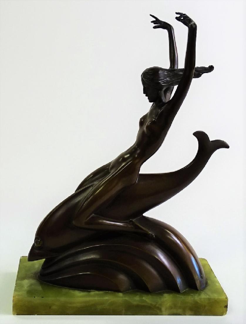 JOSEPH MOTTO PATINATED BRONZE SCULPTURE OF NUDE: Motto, Joseph (Austrian, 1891 - 1965); Original untitled patinated bronze sculpture modeled in the form of a nude female riding a dolphin, mounted atop a rectangular onyx base. Incised artist signatur