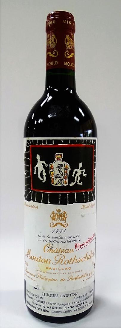 1994 750ML CHATEAU MOUTON ROTHSCHILD RED WINE: This is still youthful in appearance of dark ruby color. It sets an excellent example for the 1994 vintage with a spicy, toasty nose showing lots of blackcurrants and tar. It's full-bodied, refined an