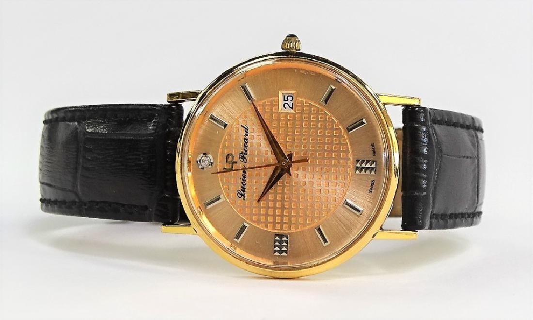 LUCIEN PICCARD 18KT ROSE GOLD UNISEX WRIST WATCH: Gold face dial, black strap. In fabulous working order. From a Boca Raton estate. Case is marked 18KT 24787. Shipping US $20 plus insurance.