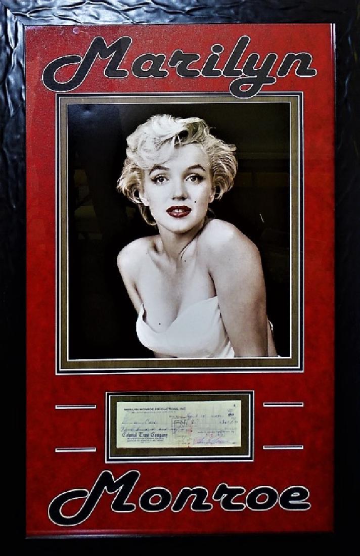 AUTHENTIC MARILYN MONROE SIGNED CHECK DISPLAY: Rare, one of a kind framed entertainment memorabilia piece featuring the signature of famous American actress and model Marilyn Monroe. Presenting a hand-signed check payable to cash in the amount of