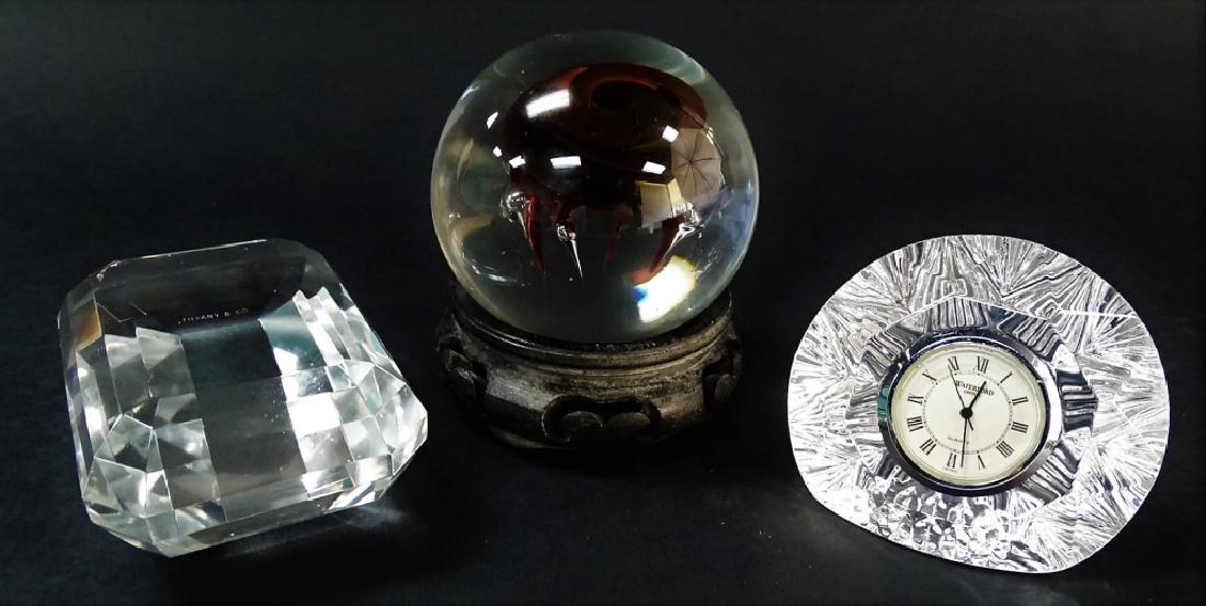 LOT OF 3 SIGNED PAPER WEIGHTS TIFFANY WATERFORD: To include a blow glass by Caitlin's, with Waterford paper weight clock, and Tiffany Diamond shaped paper weight. All in excellent condition. We will not ship can refer local shippers.