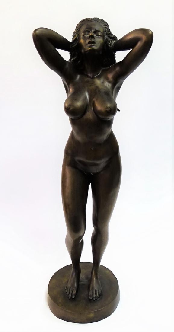 20TH C. CAST BRONZE NUDE SCULPTURE: Tall 20th century cast bronze sculpture modeled in the figural form of a standing nude female. Unsigned. Stands approx. 34-1/2"H. Third party shipping required. Local recommendations are available.