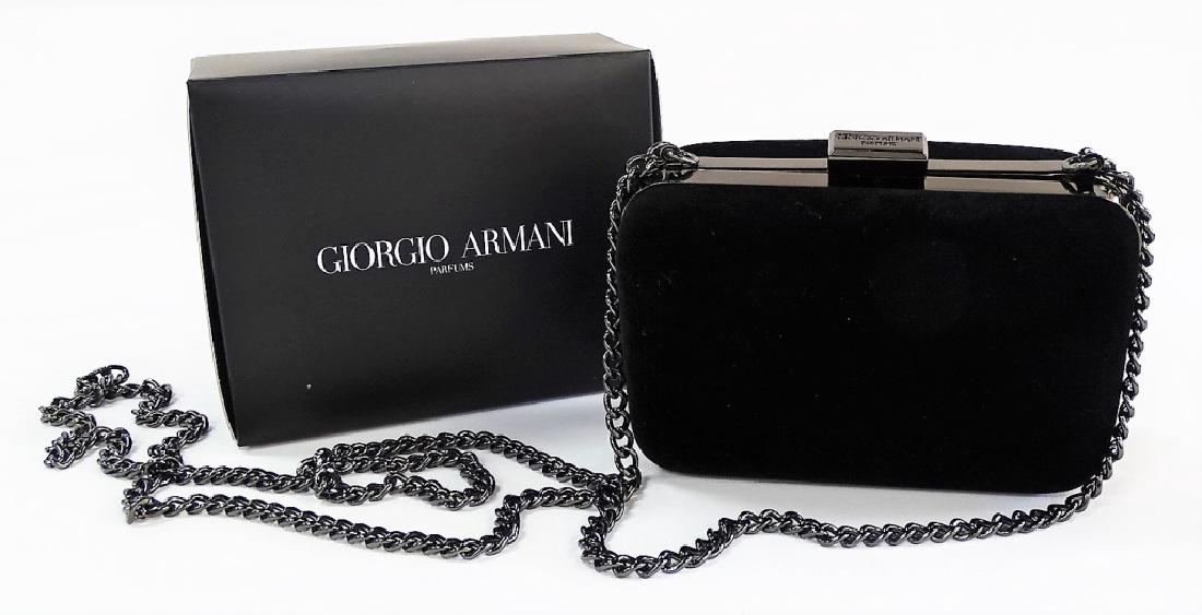 GIORGIO ARMANI PARFUMS BLACK SUEDE CLUTCH: Giorgio Armani black suede & gun metal chain clutch. Comes with original box. Measures approx. 5-1/4" Long x 4" Tall + 24" Chain Drop. In excellent condition. From a Palm Beach estate. Shipping U.S. $