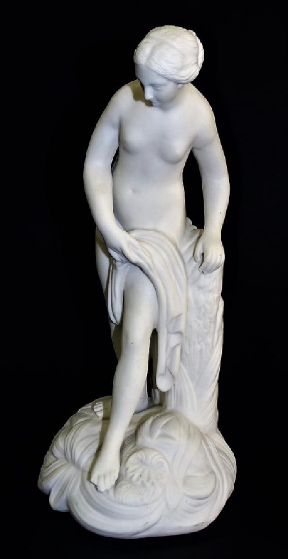 ANTIQUE PARIAN PORCELAIN 'BATHING VENUS' SCULPTURE: Antique parian porcelain figural sculpture modeled in the form of the Venus de Milo bathing. Has impressed title, initials JW, and number 59 to reverse. Stands approx. 11-3/8"H. Third party shipping r