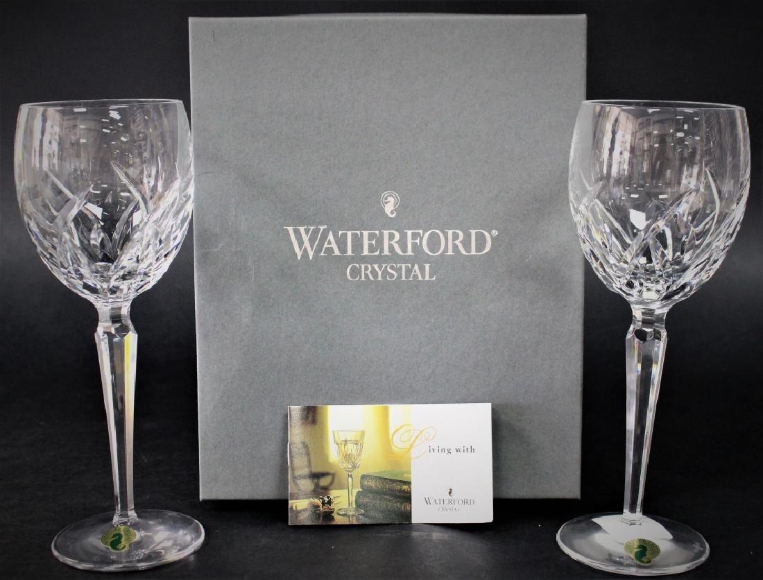 PAIR OF WATERFORD "LUCERNE" CRYSTAL WINE GOBLETS: Pair of high quality Waterford cut crystal wine goblets in the "Lucerne" pattern, measuring approx. 8-1/2"H. In original box & wrapping. Includes original booklet. Each has acid etched mark to base. E