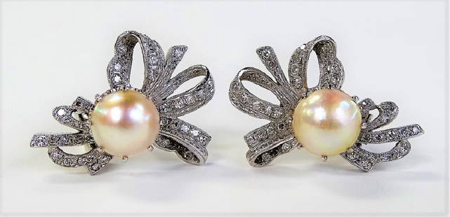 ESTATE PLATINUM PEARL & DIAMOND EARRINGS: Measures approx. 1 1/4" long. With approx. 1ct of round brilliant cut diamonds. Property of a Palm Beach estate. Total weight 1.6 grams. Shipping to be $20 plus insurance.