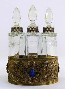 ANTIQUE CZECH RARE CABACHON PERFUME CLUSTER: Antique Czechoslovakian triple bottle cluster, in ornate brass mount. Containing two half circle shape bottles and one rectangular form bottle. Decorated with Lapis Lazuli and Malachite cabochon