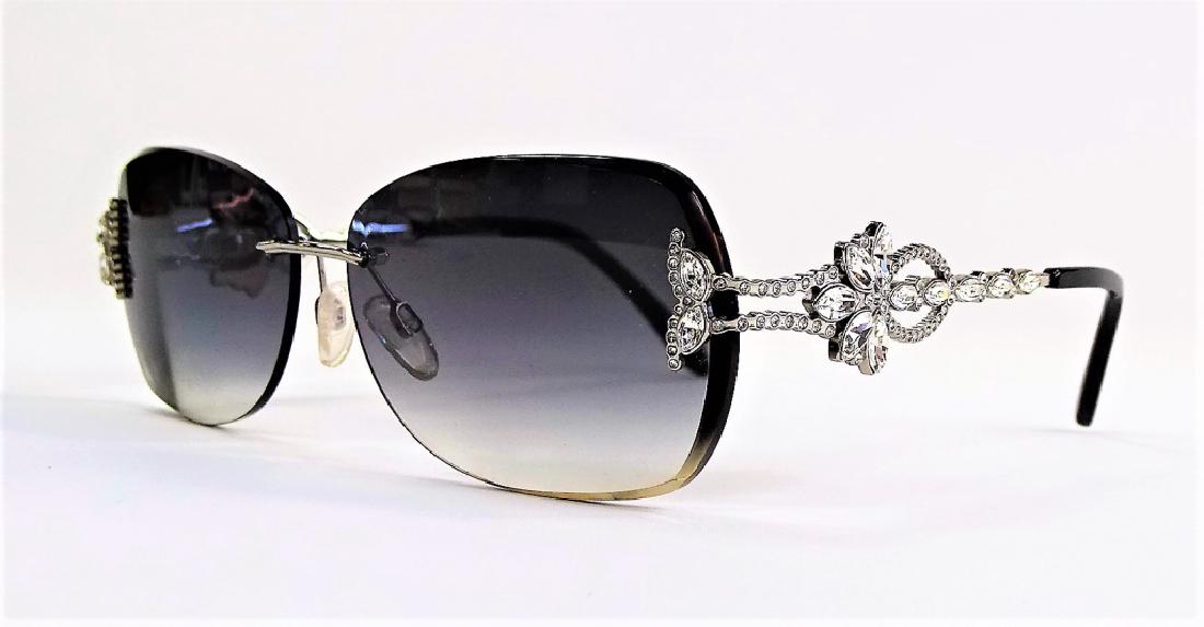 LADIES CAVIAR CHAMPAGNE SERIES SUNGLASSES: Pair of ladies' Caviar designer sunglasses from the Champagne Series, model No. 5598. With rhinestone jeweled frames. Third party shipping required. Local recommendations available.