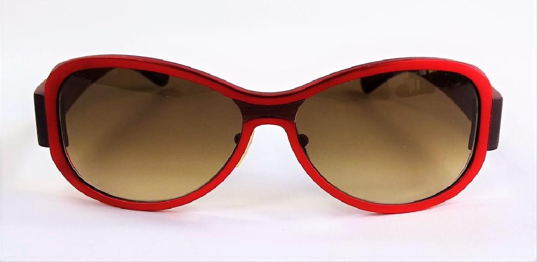 LADIES GOLD & WOOD - PARIS DESIGNER SUNGLASSES: Pair of ladies' Gold & Wood - Paris designer sunglasses, with a combination of metal and wood in dark red color. Hand crafted in Luxembourg. Third party shipping required. Local recommendations availa