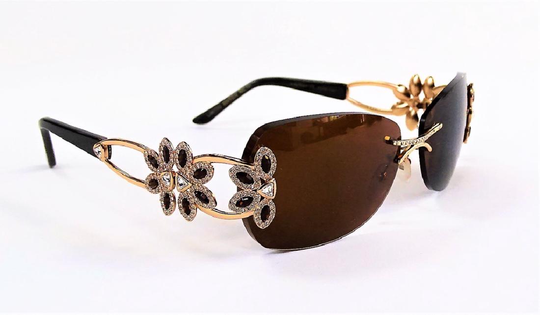 LADIES CAVIAR CHAMPAGNE SERIES SUNGLASSES: Pair of ladies' Caviar designer sunglasses from the Champagne Series, model No. 6851. With rhinestone jeweled frames. Third party shipping required. Local recommendations available.