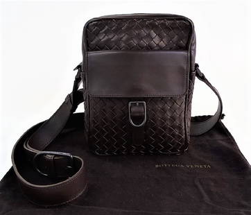 BOTTEGA VENETA WOVEN LEATHER CROSSBODY CAMERA BAG: Bottega Veneta brown leather woven cross body shoulder bag. Features front pocket & top zipper closure. Comes with original dust cover. Measures 6.5" x 3" x 8.5" + 21" adjustable strap. From a Boca