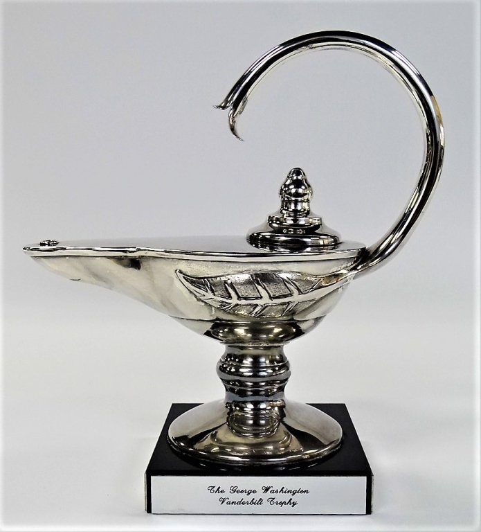 SILVER PLATE DEDICATED LAMP TROPHY: The George Washington Vanderbilt silver plate lamp trophy from The Netherlands Chamber of Commerce in the United States (1903 - 1998). Awarded to recipient Mr. Kersen L. de Long in 1998. Mounted atop 