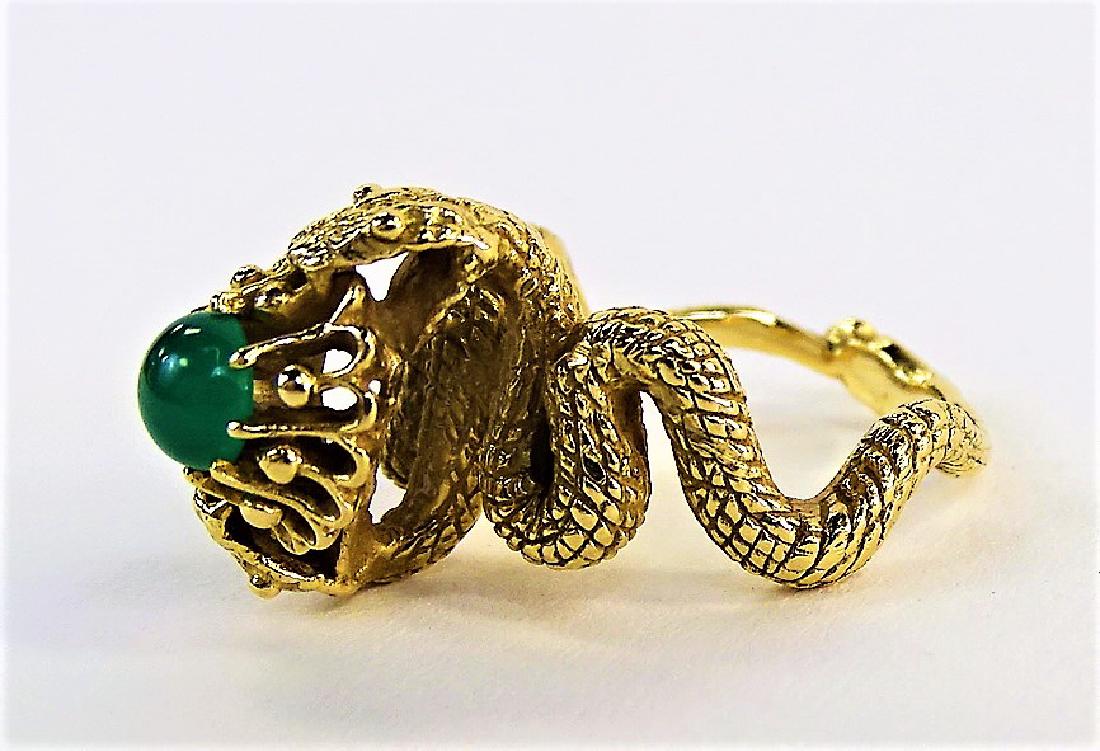 LADIES 14KT YELLOW GOLD & JADE DOUBLE SERPENT RING: Ladies' 14 karat yellow gold ring with double Serpent design, set to the center with a round Jade cabochon. Ring size 7-1/4. Weighs approx. 7.1 dwt (11 grams). Shipping to be $20 + insurance in US.