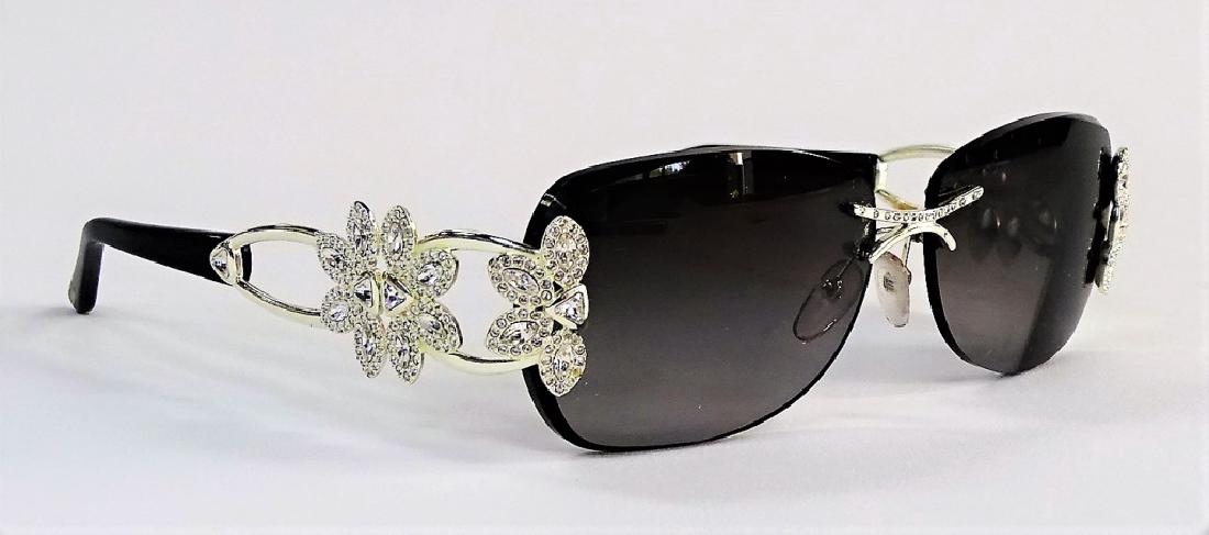 LADIES CAVIAR CHAMPAGNE SERIES SUNGLASSES: Pair of ladies' Caviar designer sunglasses from the Champagne Series, model No. 6851. With rhinestone jeweled frames. Third party shipping required. Local recommendations available.