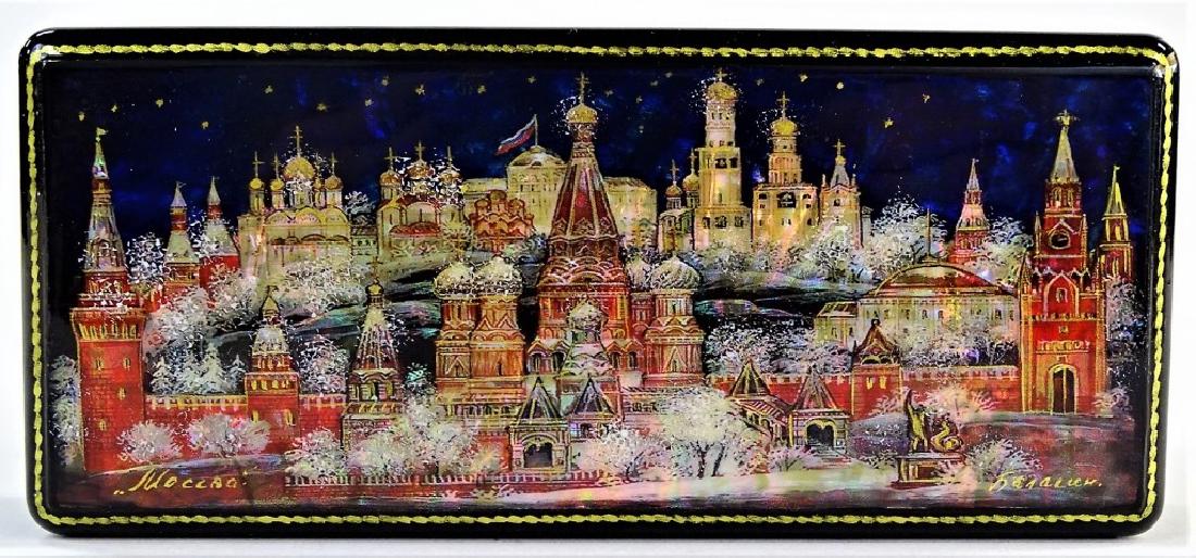 HAND PAINTED MOTHER OF PEARL RUSSIAN LACQUER BOX: Fine Russian lacquer casket box, in rectangular shape, with central town scene hand-painted over a Mother of Pearl surface. Artist signed in cyrillic. Measures approx. 1-3/8"H x 5-3/4"L x 2-1/2"W. Thi