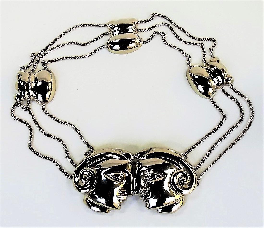 PATRICIA VON MUSILIN STERLING SILVER BELT: Very ornate Patricia Von Musulin designers .925 sterling silver statement belt, featuring five oversized charms, the larger two in profile face form and the others in unique decorative forms. Made cir