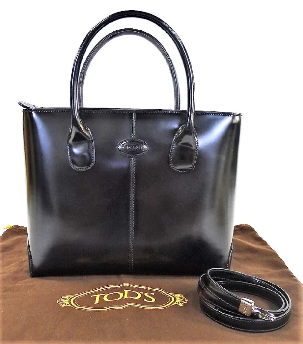 TODS BLACK LEATHER HANDBAG WITH DUST COVER: This bag features a zipper top closure with double rolled leather handles and the interior has a single zipper side pocket. Comes with detachable shoulder strap & original dust cover. Measures 11-1/4"