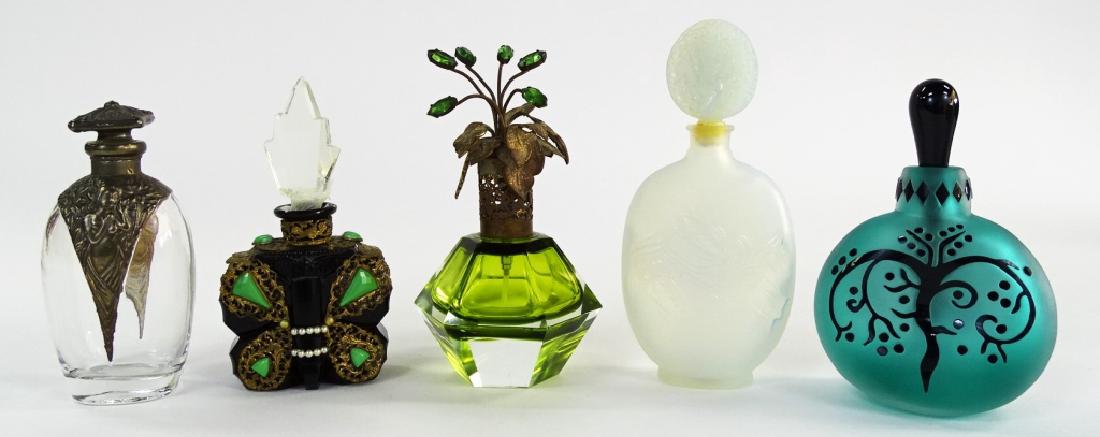 5 VTG GLASS & CRYSTAL PERFUME BOTTLES: Collection of five assorted vintage glass and crystal perfume bottles. To include; one Czech green facet cut crystal atomizer bottle with floral cap, one glass bottle with pewter overlay, one Charmel 
