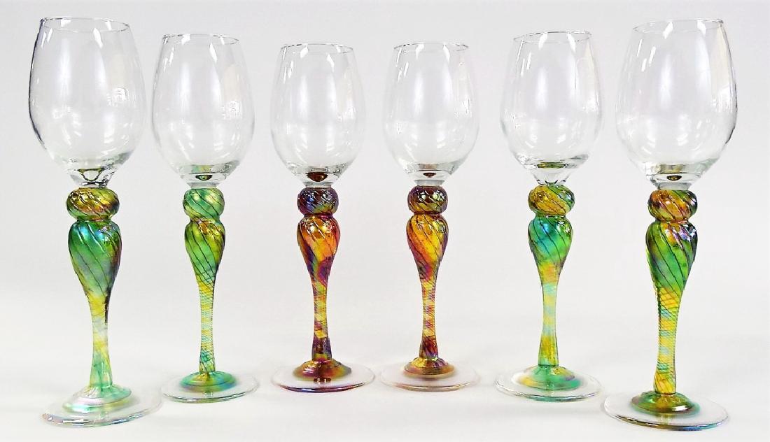 6 NEW ORLEANS IRIDESCENT ART GLASS WINE GLASSES: Collection of six Wine Glasses having colorless cup portions applied to iridescent art glass stems, simply signed "New Orleans". Each measures approx. 10-1/2"H. Third party shipping required. Local re