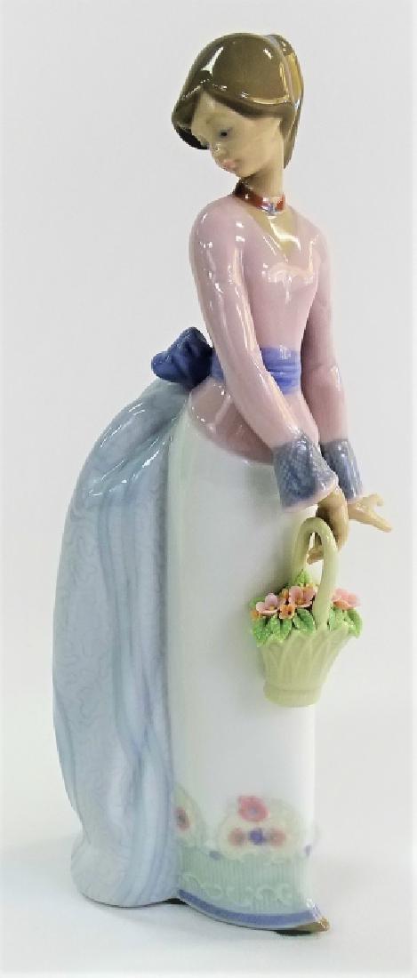 LLADRO PORCELAIN "BASKET OF LOVE" FIGURE #7622: Lladro porcelain "Basket of Love" figure #7622. Issued and retired in 1994 as a Society Piece. Sculpted by Jose Puche. Has a glazed finish. Stands approx. 9-3/4"H. Third party shipping required. Local