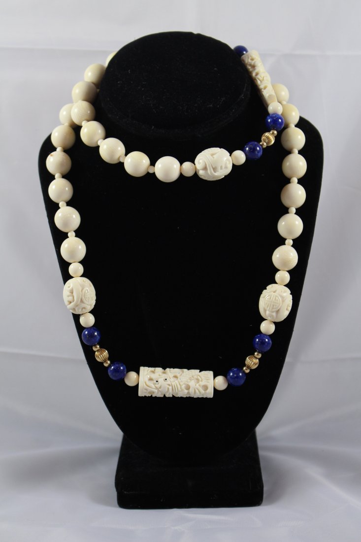 14KT YELLOW GOLD LAPIS AND IVORY CHINESE NECKLACE: 34" long, all hand CARVED 4 gold beads , 8 carved lapis beads 123 grams total weight , dates to the early 20th century. Total weight just under 15DWT. we do NOT condone the sale of endangered animals,